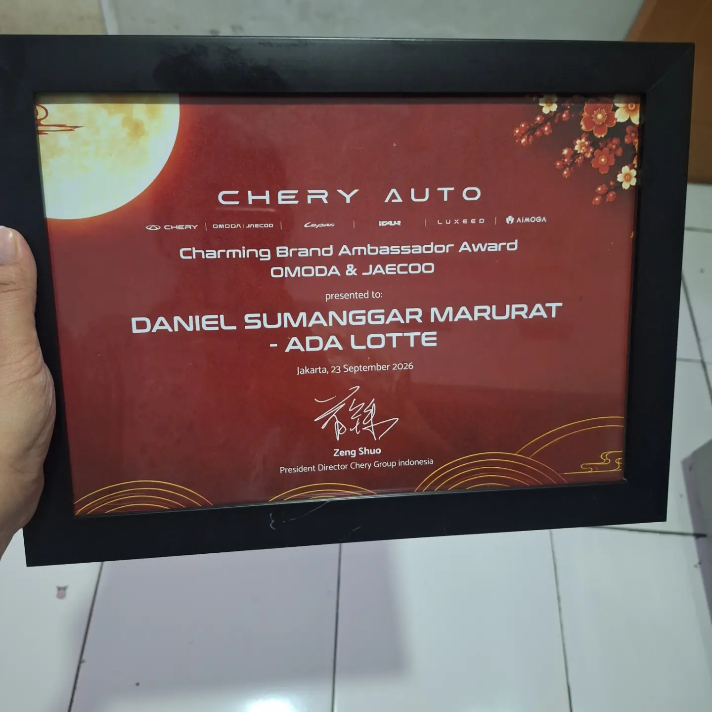 Piagam Charming Brand Ambassador Award OMODA & JAECOO untuk Daniel dari ADA Lotte, bertanggal 23 September 2026